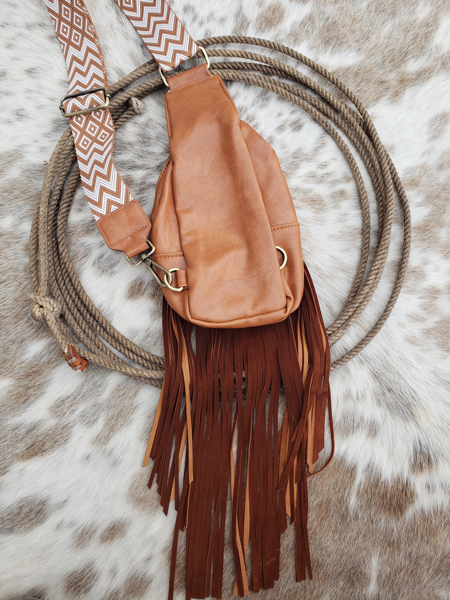 Small brown sling bag with cactus floral and fringe
