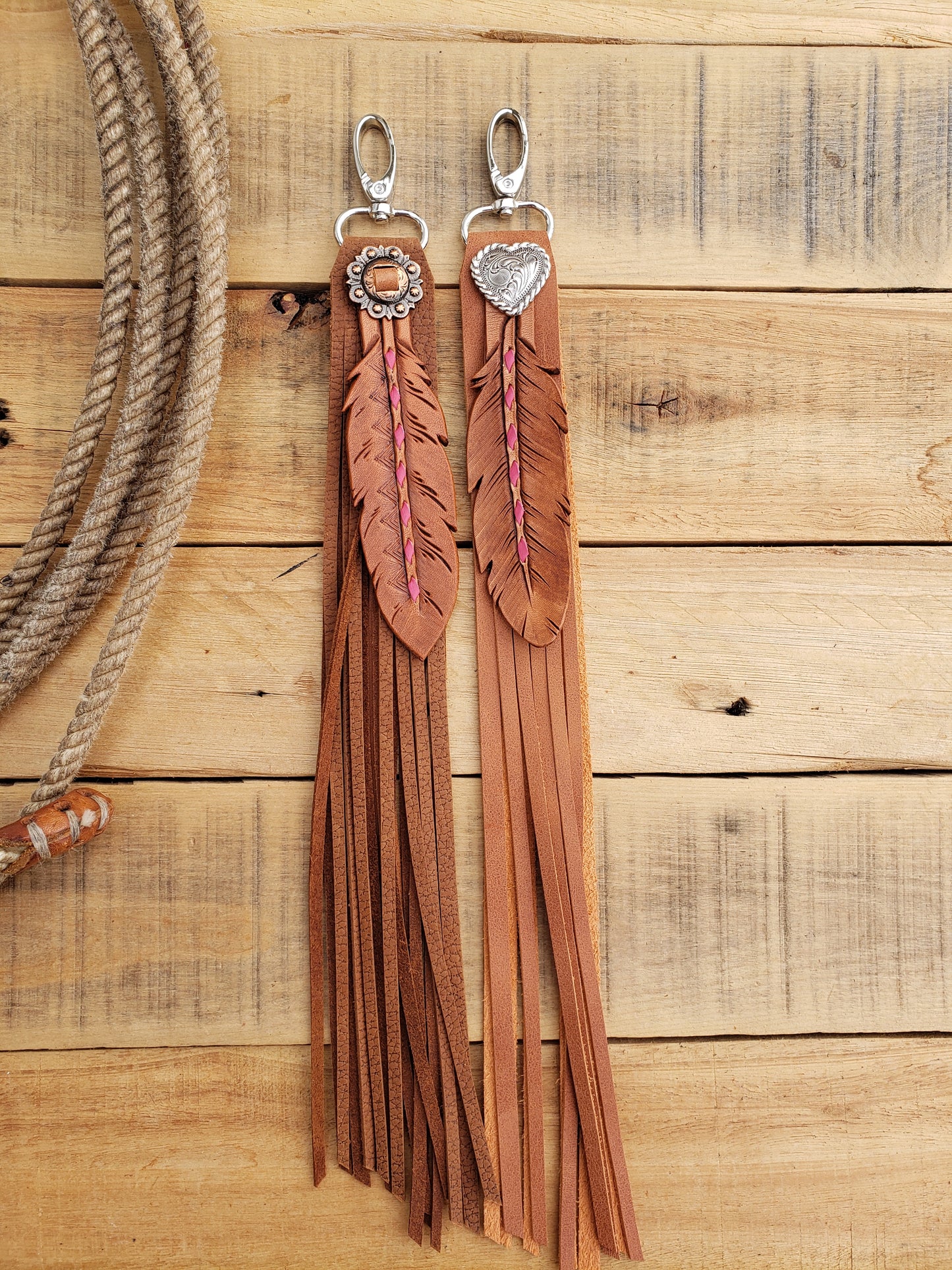 Pink buckstitch fringy feather