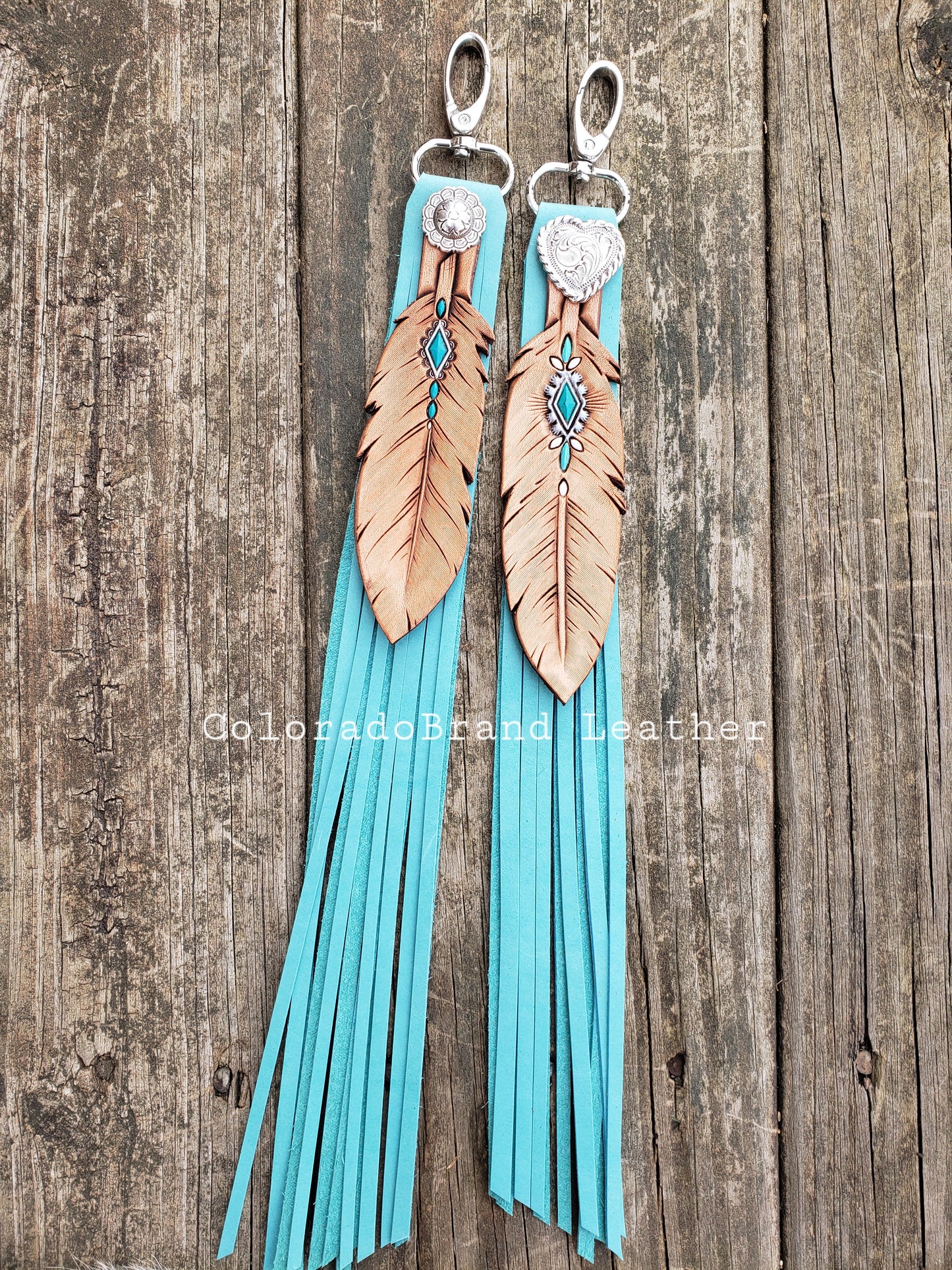 Fringy feather charms with painted turquoise accents and turquoise fringe