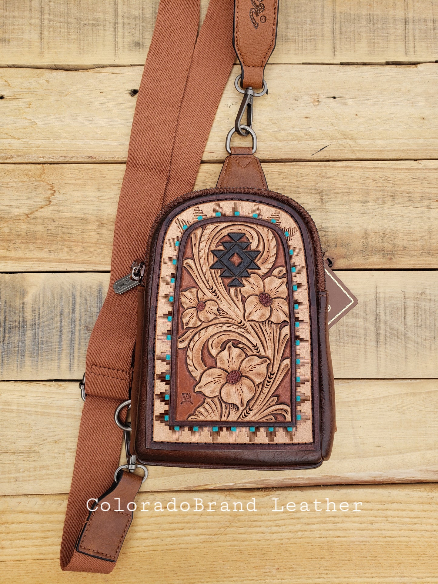 Wrangler sling bag with tooled patch with western floral and aztec