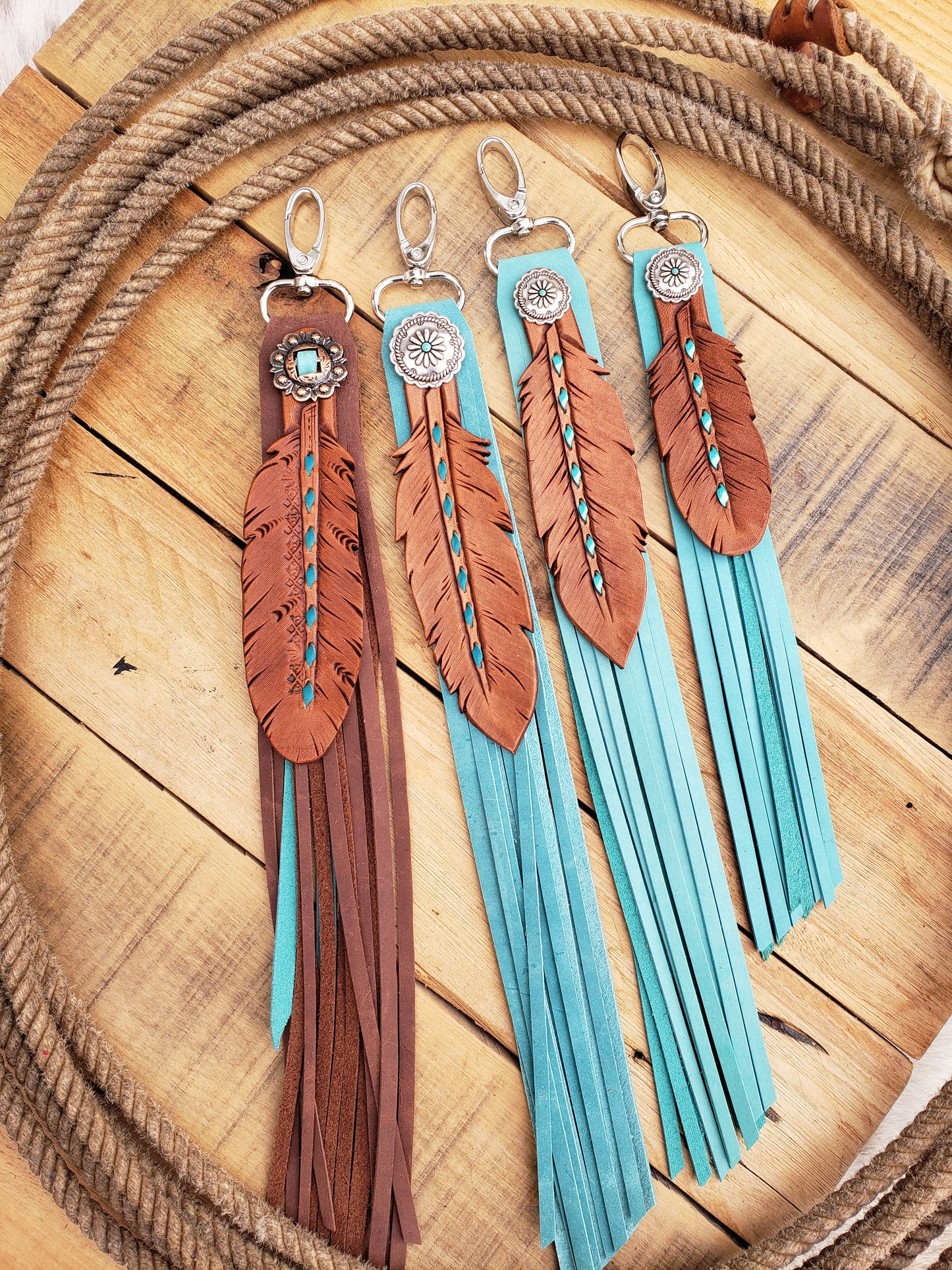 Turquoise buckstitch fringy feather charm