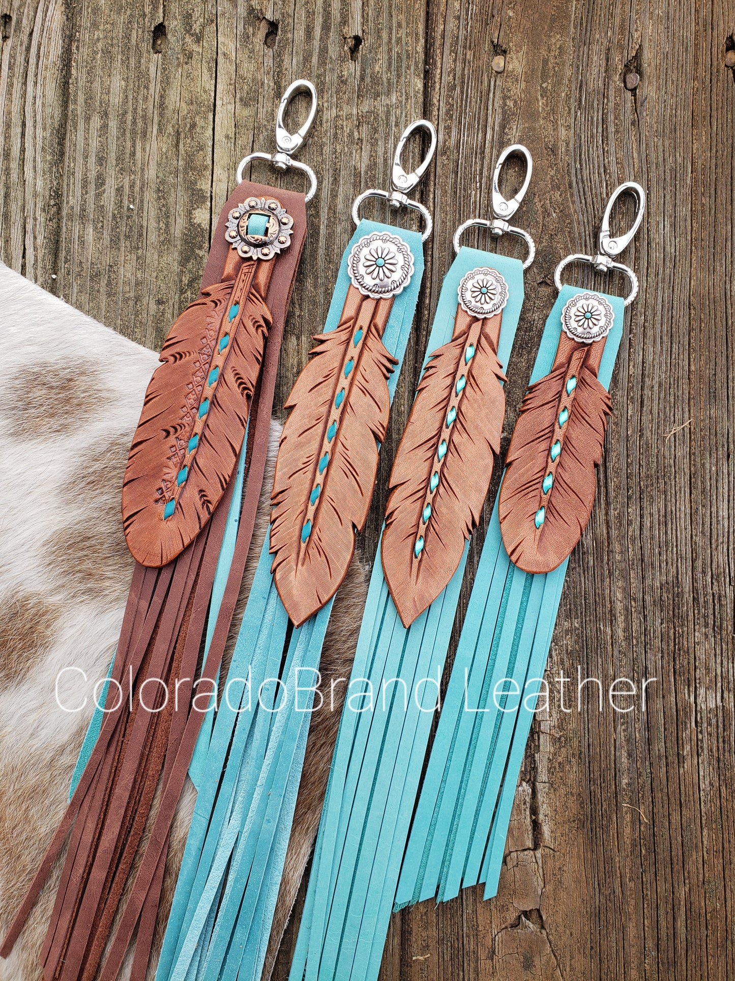 Turquoise buckstitch fringy feather charm