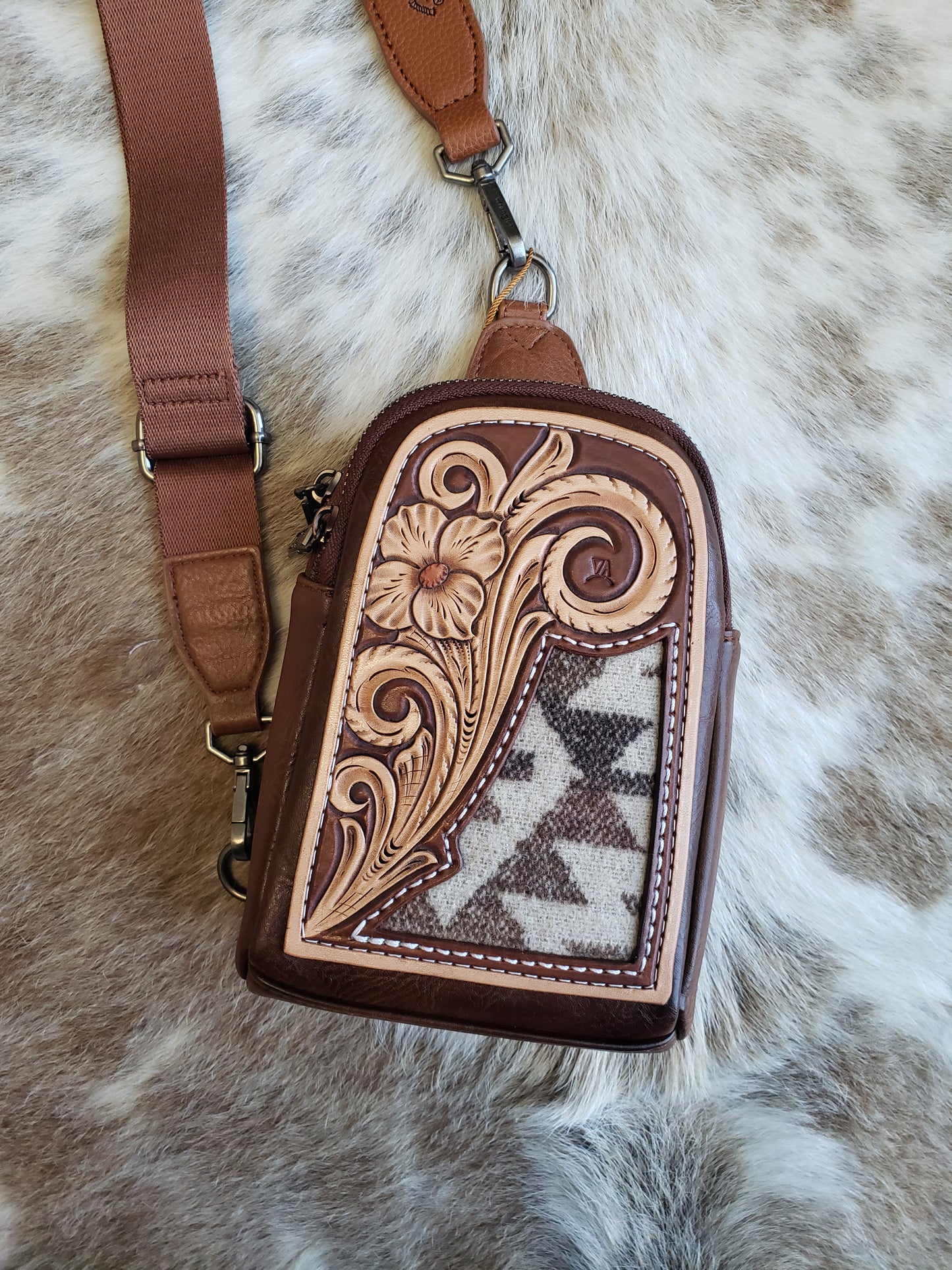 Wrangler sling bag with tooled patch and aztec inlay