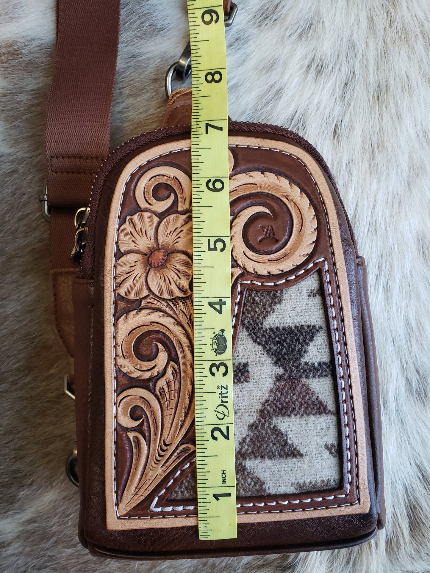 Wrangler sling bag with tooled patch and aztec inlay