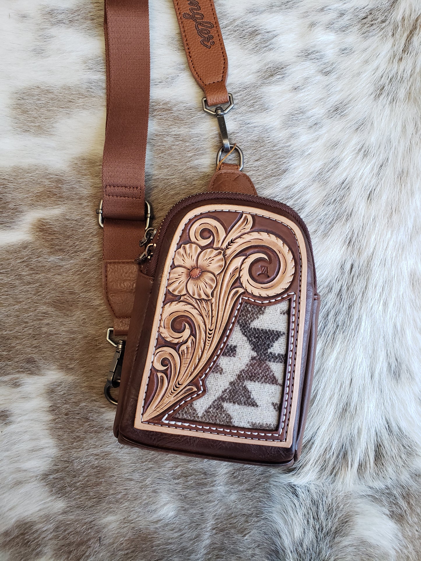 Wrangler sling bag with tooled patch and aztec inlay