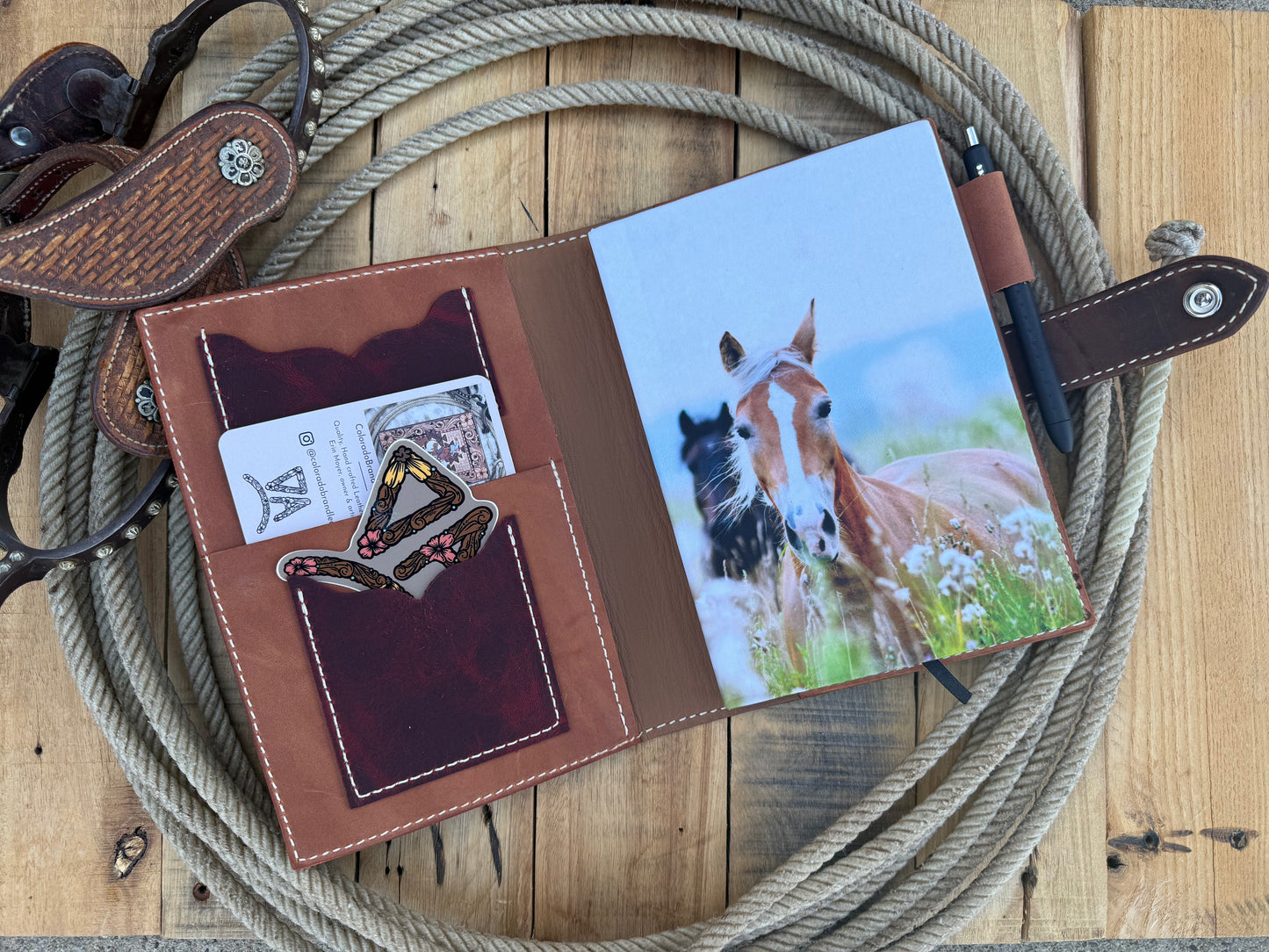 Tooled leather notebook cover, horses, sunflowers, and paintbrush