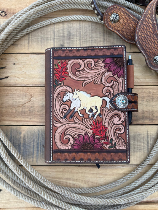 Tooled leather notebook cover, horses, sunflowers, and paintbrush